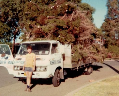 vintage picture of man in front of truck