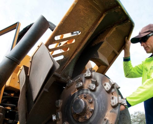 stump grinding machine and operator