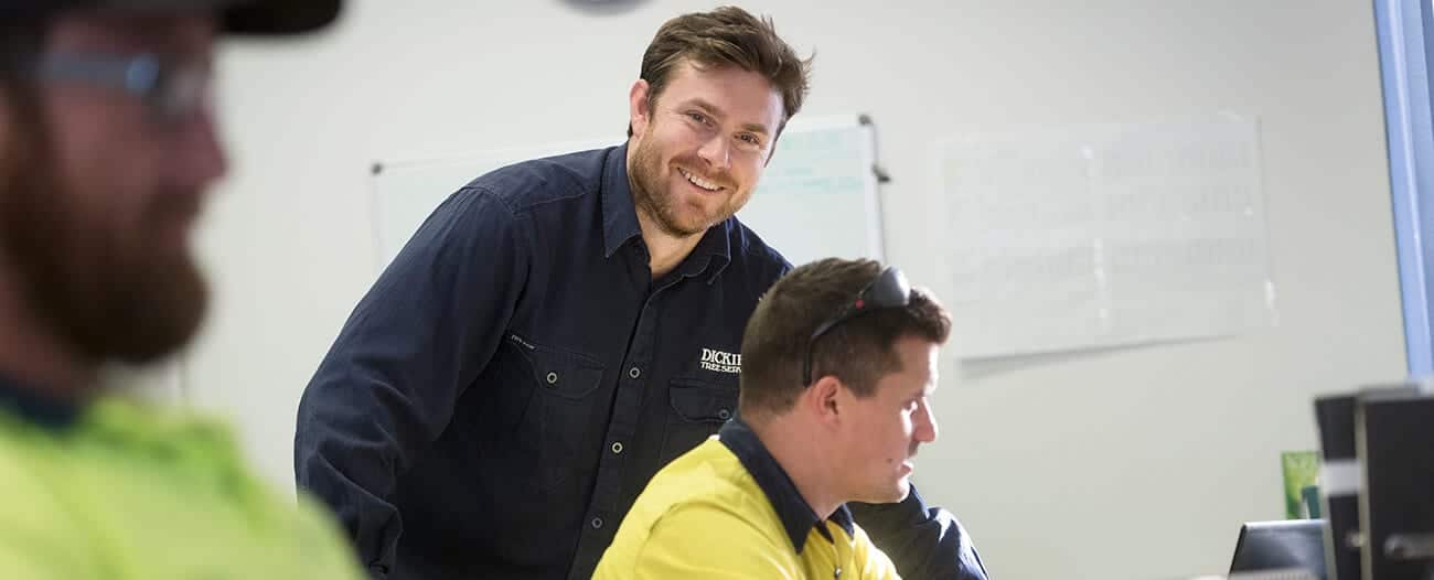 smiling staff looking at camera